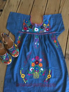 "Beautiful! Hand embroidered Denim Dresses ! Huaraches not included. Sold separately. Each dress is one of a kind embroidery. Size : SMALL ( 6 US ) Fabric: soft denim - fresh - great quality. Care : hand wash or dry cleaning. NO WASHING MACHINE. MEASUREMENTS: Length: 34\" Armpit to armpit: 19\" Dresses are ready to ship." Embroidered Bohemian Denim Dress, Spring Cotton Embroidered Dress With Machine Embroidery, Blue Embroidered Bohemian Denim Dress, Blue Bohemian Embroidered Denim Dress, Cotton Embroidered Dress With Machine Embroidery For Spring, Bohemian Embroidered Denim Dress, Traditional Spring Embroidered Dress With Machine Embroidery, Traditional Spring Embroidered Dress, Embroidered Denim Dress For Summer