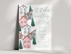 a card with houses and trees on it, in pastel colors that say it takes a village