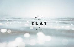 the word flat is overlaid by water and light blue hues in this image