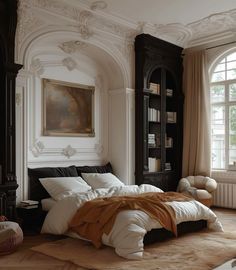 a large bed sitting in the middle of a bedroom next to a book shelf and window