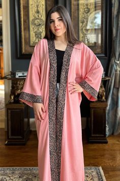 Featuring: Open Abaya Kimono. Golden Arabic Calligraphy embroidery lining on opening and sleeves hem. Maxi Length. Color: Pink.Fabric: Linen.Brand: Unmatched BYU Length: 55 inches. Elegant Long Sleeve Abaya With Embroidered Border, Traditional Long Sleeve Pink Abaya, Traditional Long Pink Abaya, Traditional Pink Long Sleeve Abaya, Long Abaya With Embroidered Border For Eid, Long Sleeve Dabka Kimono For Eid, Embroidered Long Kimono For Eid, Embroidered Long Sleeve Kimono For Eid, Arabic Calligraphy Embroidery