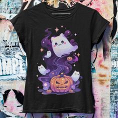 Celebrate Halloween with our adorable Pastel Gothic Ghost Cat T-shirt, showcasing a whimsical ghost cat nestled inside a pumpkin. This charming design blends the mystic allure of pastel goth with a playful Halloween theme, perfect for those who love their spooky season with a dash of cute. Designed to be unisex and available in oversized and plus sizes, this tee is ideal for anyone into Japanese streetwear, or as a quirky gift for fans of anime, pastel goth, and grunge styles. Embrace the spirit Kawaii Halloween Graphic Print Tops, Kawaii Halloween Short Sleeve T-shirt, Kawaii Short Sleeve Halloween T-shirt, Spooky Halloween T-shirt With Cat Design, Spooky Cat Design T-shirt For Fall, Pastel Goth Anime, Anime Pastel, Unique Crop Tops, Goth Anime