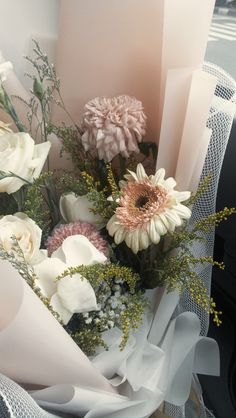 a bouquet of flowers sitting on top of a table