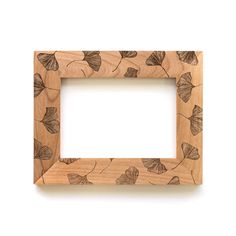 a wooden frame with leaves drawn on it