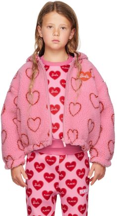 Long sleeve sherpa fleece jacket in pink. Graphic pattern printed in red throughout. · Zip closure · Welt pockets at waist · Elasticized cuffs and hem · Machine wash Reverse in black technical satin. Graphic printed in pink throughout. Part of the Barbie capsule collection. Available exclusively at SSENSE. Model measures 50.75 / 129 cm tall and wears size 8. Supplier color: Pink Size: child's height 4: 41.25” / 105 cm 6: 46.75” / 118.5 cm 8: 52.25” / 132.5 cm 10: 55.25” / 140.5 cm 12: 58.5” / 14 Cute Pink Fleece Outerwear, Playful Winter Fleece Outerwear, Playful Fleece Outerwear For Fall, Playful Pink Winter Outerwear, Playful Long Sleeve Fleece Outerwear, Trendy Pink Fleece Outerwear, Pink Hooded Fleece Jacket, Hooded Pink Fleece Jacket, Pink Fleece Outerwear With Fleece Lining