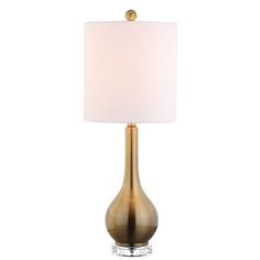 a table lamp with a white shade on top and a gold base, against a white background