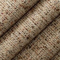 close up view of fabric textured with brown and white colors