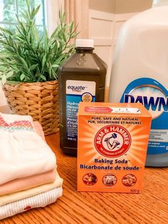 baking soda, dishwasher detergent and cloths on a table