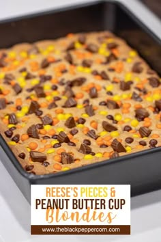 reese's pieces and peanut butter cup blondies in a baking pan with text overlay