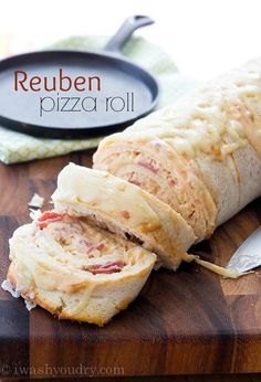 a pizza roll cut in half on a cutting board