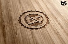 a wooden logo with the letter d on it