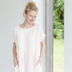 "Handcrafted Oeko-Tex Standard certified 100% European linen smock dress ideal for everyday wear. Perfect for springtime or chilly summer days. Always dress to kill! Neckline: round Silhouette: shift Length: ±37\"/94cm (we can make adjustments) Sleeve length: short Pockets: side seam Details: *Colour shown: pink *Model is wearing size M *Medium weight *Maternity-friendly *Relaxed fit *Not-ironed (and no need to) *Handmade by @LinenCloud Easy care: - Machine wash gentle - Wash seperately or with Spring Sundress In Linen With Relaxed Fit, Casual Pink Linen Dress For Spring, Feminine Linen Dress For Summer Daywear, Feminine Short Sleeve Linen Summer Dress, Casual Pink Linen Dress For Vacation, Spring Summer Linen Tunic Dress, Summer Tunic Linen Dress For Spring, Casual Pink Linen Vacation Dress, Pink Linen Dress For Summer Daywear