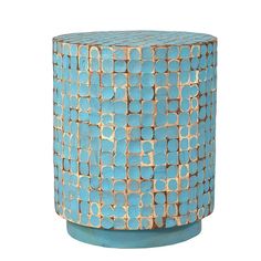 a blue and gold vase sitting on top of a table