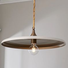 a light fixture hanging from the ceiling in a room