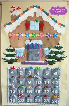 a felt christmas calendar hanging on a wall