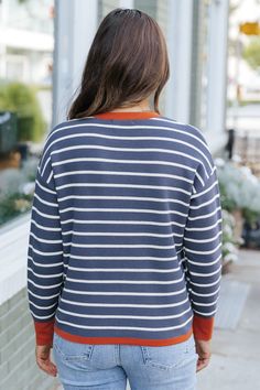 Upgrade your fall wardrobe with our Navy Stripe Contrast Sweater! This stylish and versatile piece features a subtle orange contrast detail at the neckline and cuffs, adding a pop of color to your outfit. Made with a comfortable crew neckline, stay cozy and chic all season long. Style with your favorite denim jeans, sneakers, and simple accessories for a chic everyday outfit. Simple Accessories, Everyday Outfit, Long Style, Stay Cozy, Navy Stripes, Fall Wardrobe, Everyday Outfits, Crew Neckline, Denim Jeans