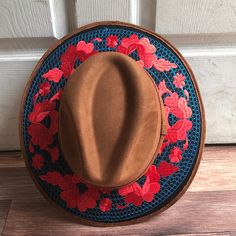 Stand out with this beautiful handcrafted Mexican Suede Hat with beautiful detailed floral embroidered canvas brim. Perfect accessory to add that with that daily outfit. MADE IN MEXICO By: Mexican Artisans For: Women Size: Medium 23' Color: brown | blue | red Details: Top Suede Embroidered canvas brim Inner elastic band Contact us for more details PLEASE READ BEFORE PURCHASE: The picture is an ACCURATE REPRESENTATION.Colors in the pictures may vary a little by effects of light. Each product is h Embroidered Brown Cap, Summer Felt Cap, Brown Spring Hat One Size, Artisan Hat For Spring, Artisan Spring Hat, One Size, Brown Hats For Spring, Artisan Spring Hat One Size Fits Most, Embroidered Brimmed Spring Hats, Artisan Short Brim Hat For Spring