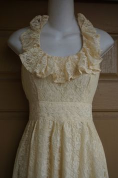 "Lovely lace prairie dress. Has the Gunne Sax style and look. No tags. Maxi length. Estimated size Small. Zips in back. Condition is good -no flaws to note! measurements taken across front lying flat Length50\" armpit to bottom Bust16.5\" laying flat Waist12.5\" empire Hips30\"" Fitted Maxi Dress With Delicate Lace For Spring, Beige Scalloped Lace For Spring, Cream Lace Maxi Dress With Lace Trim, Cream Lace Dress With Ruffles, Cream Lace Dress With Lace Bodice For Summer, Beige Lace Dress With Ruffles, Feminine Cream Lace Dress With Ruffles, Cream Lace Dress With Ruffles In Feminine Style, Beige Ruffled Lace Dress