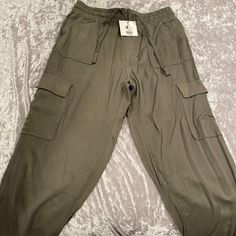 Brand New Green Cargo Draw String Pants Six: Small Casual Cargo Capri Pants With Pockets, Casual Capri Length Cargo Pants, Casual Capri Pants With Side Pockets, Casual Summer Cargo Capri Pants, Spring Casual Cargo Style Capris, Casual Capri Length Cargo Pants For Summer, Casual Summer Capri-length Cargo Pants, Spring Casual Cargo Capri Pants, Spring Casual Capri Length Cargo Pants