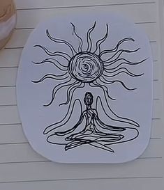 a drawing of a person meditating in front of a sun