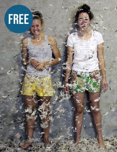 two women standing next to each other with confetti all over them