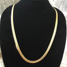 It is what it is. Faux gold bling. Circa 1980's Gold Necklace 16 Inch For Party, Gold Formal Herringbone Necklace, Formal Gold Herringbone Chain Necklace, Gold Herringbone Chain Necklace For Formal Occasions, Formal Gold Herringbone Necklace, Vintage Gold Chain Necklace For Party, Gold Costume Jewelry Necklace, 16 Inch Length, Gold Costume Jewelry Necklace 16 Inch Length, Gold 16 Inch Costume Jewelry Necklace