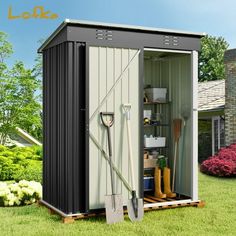 an outdoor storage shed with its door open and tools in the yard next to it