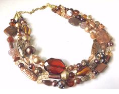 "Gorgeous shades of brown beaded confetti necklace. 16\" with a 4\" extender chain. Our signature confetti necklaces are created with an artistic eye for color palettes and with an emphasis on wearability. This particular \"Chocolate Dream\" necklace is made with mother of pearl shell Beads, glass pearls, acrylic gemstone faceted Beads, and Swarovski glass crystals. Each necklace is made with the same type of beads but will have slightly different placement from the one shown in the photos as th Light Pink Jewelry, Chocolate Dreams, Jewel Wedding, Chunky Statement Necklace, Artisan Necklace, Beading Jewelry, Silver Necklace Statement, Rainbow Necklace, Purple Jewelry