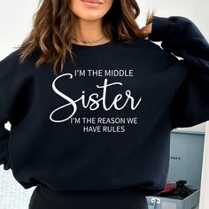 Matching Shirts For Sisters, Fun Mothers Day Shirts I am the oldest Youngest Middle sister Unisex Crewneck Sweatshirt Including Youth Shirts This sweatshirt is the perfect gift for your loved one or for yourself! Design is printed on your custom shirt via DTG method. NO Vinyl FUN GIFT IDEAS Check out our shops here: https://www.etsy.com/shop/VCApparelCreations https://vcapparelcreations.etsy.com https://vcgiftstores.com SHIRT SIZING ✨ All of our shirts are UNISEX sweatshirts and made with the highest quality materials and are super soft and cozy!  They are 50% Cotton 50% Polyester. Unisex shirts generally run slightly larger than women's shirts and slightly smaller than typical men's shirts. Very close to True to size. If you're looking for a more fitted look, we recommend sizing down and Sister Sweatshirts, Fun Gift Ideas, Middle Sister, Family Reunion Shirts, Reunion Shirts, Sibling Shirts, Sisters Funny, Sister Tshirts, Cute Shirt Designs