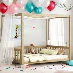 a child's bedroom with balloons and confetti