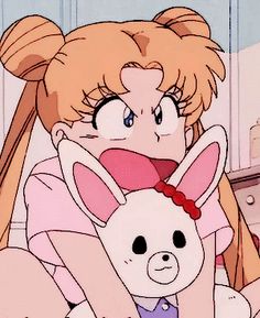 an anime character holding a stuffed animal in her lap