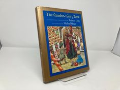 the rainbow - colored fairy book is on display