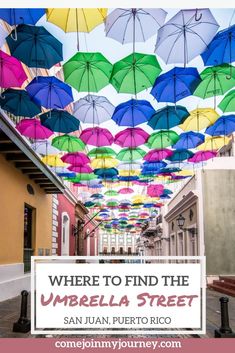 colorful umbrellas hanging from the ceiling in an alleyway with text overlay where to find the umbrella street san juan puerto