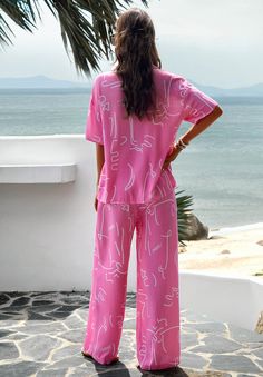 Get ready for some fun in the sun with our Beach Vacation Matching Set! This pink set includes everything you need for a stylish and coordinated beach look. No need to stress about packing, we've got you covered. Soak up the sun and turn heads with this must-have set! Size Guide: Model is 5’6” tall, and has a 33.2” bust, 26.4” waist, & 35.2” hips. She is wearing a S / US 4 / AU 8. This matching set is true to size. Material: 100% Viscose. Feature: Collared. Tropical print. Breathable Fabrication. Front button closures. Wide leg pants. Relaxed fit. (1 pcs top + 1 pcs pants, 2 pcs in total) Care Instructions: Machine wash / Cold hand wash Soak Up The Sun, Pink Set, White Dress Party, Prom Outfits, Fun In The Sun, Beach Look, Spring Tops, Daily Dress, Long Sleeve Bodycon