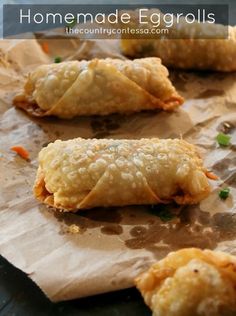 homemade eggrolls are sitting on wax paper