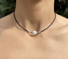 THANK YOU 🦋 for visiting my small shop. I am very grateful for your support. This is a 12mm white moonstone 12mm bead, pi stone, and leather necklace. I try my best to take photos that best depict the item as it appears in person, but if you have any questions, please reach out and contact me.  🦉 The moonstone pendant is 12mm on a genuine leather cord 16 inches, with stainless steel beads and a 1-inch extension chain.  🦉  The package comes nicely packaged including a velvet pouch that can be White Round Choker For Gift, Dharma Wheel, Chakra Racine, Leather Choker Necklace, Crystal Necklaces, White Moonstone, Leather Chokers, Velvet Pouch, Rope Necklace