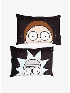 two pillows with cartoon characters on them, one is black and the other is white