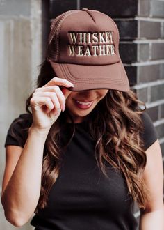 Whiskey weather is our favorite kind of weather at Panache! Our newest brown trucker hat features our well-known "Whiskey Weather" phrase, and is perfect for a fall day out with friends. Brown trucker hat Tan "Whiskey Weather" embroidered on the front Adjustable snapback closure Breathable mesh in the back Designed in the U.S.A. Produced in China. Brown Trucker Hat, Black Trucker Hat, Knitted Hats Kids, Knit Hat For Men, Nashville Outfits, Fall Hats, Blouse Tank Top, Fall Day, Jumpsuit Shorts Rompers