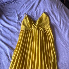 Falls Just Below The Knees, Straps Tie Behind The Back, Never Worn Yellow Pleated Beach Dress, Yellow Pleated Mini Dress For Summer, Yellow Pleated Mini Dress For Party, Yellow Pleated Party Mini Dress, Yellow Pleated Maxi Dress For Party, Summer Party Midi Dress Pleated, Yellow Sun Dress, Blue Velvet Dress, Casual Sundress