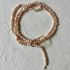 ** Pearl Necklace loops through Ring and can be wrapped once or multiple times. PEARLS are symbolic of wisdom gained through experience. The gems are believed to offer protection, as well as attract good luck and wealth. They are well-known for their calming effects. Pearls have a way of bringing balance to your karma, bring illumination, enlightenment, and insights on a mental level. Pearls symbolize purity and is known as a “stone of sincerity”. It brings truth to situations and loyalty to a “ June Zodiac, Gemini Zodiac, Keshi Pearls, Crown Chakra, Good Luck, Pearl Necklace, Gems, Ring, Stone