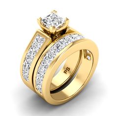 a yellow gold wedding ring set with two princess cut diamonds on the sides and side stones