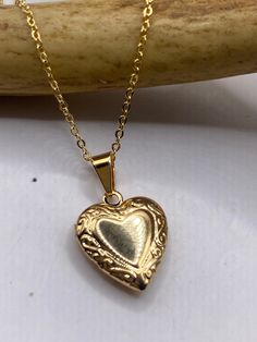 These sold out when we last had them, get yours on order today! Dive into nostalgia with our vintage 9k gold-filled photo heart locket on a delicate chain. Cherish your precious memories in style with this timeless piece of jewelry. Perfect for lovers of vintage charm and sentimental keepsakes. Don't miss out on this must-have locket from TomWayne Jewelers! #VintageJewelry #LocketNecklace #SentimentalStyle #TomWayneJewelers Dainty Gold Locket, Gold Vintage Necklaces, Cute Vintage Jewelry, Vintage Jewelry Gold, Classic Gold Locket Necklace With Vintage Charm, Yellow Gold Heart Pendant Locket Necklace With Vintage Charm, Antique Gold Locket Necklace With Heart Charm, Antique Gold Heart Charm Locket Necklace Gift, Vintage Gold Locket