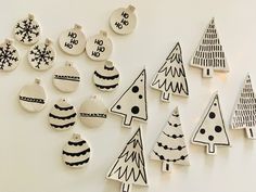 christmas ornaments are arranged on the wall in various shapes and sizes, including tree ornament