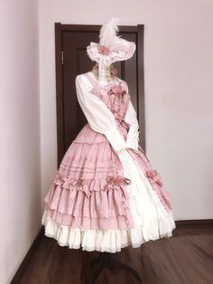 Experience timeless elegance with our Pink House Fashion Classic Lolita Dress. This exquisite piece features a full-length button closure at the front, perfect for pairing with an underskirt to achieve a stunning Rococo-inspired look. The shirring back ensures a comfortable fit, accommodating a range of body types. Available in plus sizes and offered in four enchanting colors, this dress seamlessly combines classic charm with modern comfort.  Please note: This listing is for the strap dress only Pink Skirt For Spring Costume Party, Elegant Pink Ruffled Petticoat, Elegant Pink Petticoat, Pink Buttoned Skirt For Spring, Spring Pink Petticoat With Attached Cancan, Elegant Pink Petticoat For Spring, Elegant Pink Spring Petticoat, Elegant Pink Tiered Petticoat, Pink Fitted Skirt For Costume Party