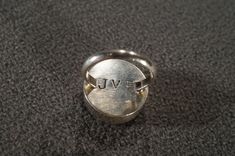 I am offering you this vintage sterling silver band ring. This ring features a fancy raised dimensional round shaped design setting. There is a bold carved out heart shape in the center of this substantial setting ! There is such appeal that is very elegant and feminine. Having just come out of an estate here in upstate New York, it measures app. 3/4 inch. It is currently a size 6.5, however it could easily be sized up or down. It weighs app. 7 grams. Buyer pays shipping and handling. Vintage Sterling Silver Engraved Dome Ring, Vintage Engraved Sterling Silver Dome Ring, Unique Stamped Rings For Anniversary, Vintage Dome Promise Ring With Polished Finish, Unique Stamped 925 Dome Anniversary Ring, Unique Stamped 925 Dome Ring For Anniversary, Unique Round Signet Ring For Anniversary, Vintage Engraved Dome Ring For Promise, Vintage Engraved Dome Promise Ring