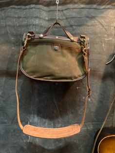 This is an updated take on a classic design. Large enough to fit your daily essentials but small enough to take everywhere. Built tough from waxed cotton canvas and leather. DIMENSIONS: 12”w x 10”h x3”d Outdoor Coated Canvas Bag With Leather Trim, Vintage Waxed Canvas Shoulder Bag With Waxed Finish, Classic Outdoor Waxed Canvas Shoulder Bag, Classic Waxed Canvas Shoulder Bag For Outdoor, Vintage Waxed Canvas Bag For Everyday Use, Classic Canvas Bag With Leather Trim, Functional Canvas Bag With Waxed Finish, Classic Outdoor Shoulder Bag With Waxed Finish, Rugged Waxed Canvas Bags With Canvas Lining