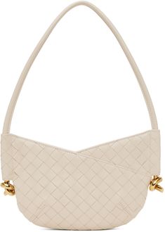 Intrecciato-woven grained lambskin shoulder bag in off-white. · Fixed shoulder strap · Knotted hardware at sides · Zip closure · Suede lining · H6 x W9.75 x D1.5 · Total height: H15.5 Supplier color: Sea salt/Brass Luxury Cream Shoulder Bag With Woven Leather, Luxury Cream Woven Leather Shoulder Bag, Luxury Cream Shoulder Bag With Intrecciato Weave, Luxury Cream Intrecciato Shoulder Bag, Formal Beige Shoulder Bag With Intrecciato Weave, Woven Design, Sea Salt, Bottega Veneta, Bags Women