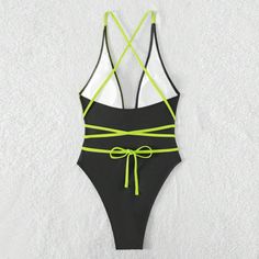 Elevate your beachside allure with our sleek and seductive one-piece swimsuit. Crafted with a minimalist design, this swimsuit features sensual straps that accentuate your curves with an air of sophistication. The premium fabric offers comfort and support while ensuring a flattering fit. Whether lounging by the pool or strutting on the sands, this swimsuit embodies pure elegance and confidencePattern: Solid colorWith or without steel support: With padded cups, no underwireColor: BlackSize: S, M, Beach Nylon Swimwear With Spaghetti Straps, Nylon Spaghetti Strap Swimwear For Beach, Beach Season Spaghetti Strap Bodysuit For Swimming, Beachwear Bodysuit With Spaghetti Straps For Beach, Beach Season Spaghetti Straps Bodysuit For Swimming, Summer Swimwear With Straps For Sunbathing, Spaghetti Strap Bodysuit For Beach Season Swimming, Summer Bodysuit With Crisscross Straps For Poolside, Sleeveless Strappy Bodysuit For Beach