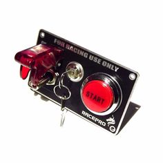 a red and black push button for racing use only