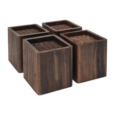 four square wooden trays sitting on top of each other